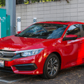 red honda civic in a parking lot