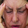 A senior woman stressed
