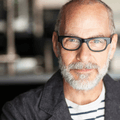 man in his 50's with glasses looking into the camera