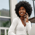 Smiling woman talking on phone