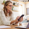 thinking mature person with technology