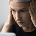 stressed woman working using laptop