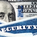 social security cards with dollar bill
