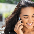 Smiling woman talking on phone