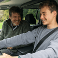 Father teaching teen son to drive