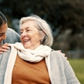 Caregiver helping woman with disability