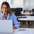 employee worker looking at laptop at workplace