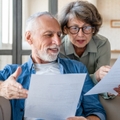 senior couple reading documents