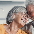 Senior couple smiling and hugging each other