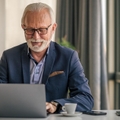 senior businessman working on laptop
