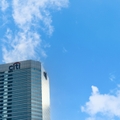 Citibank skyscraper against a blue sky with clouds