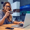 Woman with laptop and credit card