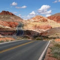Nevada road cutting through desert mountains