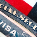 Social Security card on patriotic background