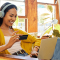 Girl on laptop with debit card