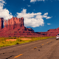 Cars on highway in Monument Valley, Utah