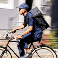 person working delivery gig on bike