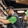 Grocery store workers stocking shelves