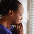 Woman in her 60s looking worried and thinking
