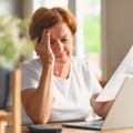 Woman stressed out with bills