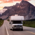 White RV Driving on scenic road
