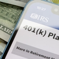 401(k) plans IRS site on phone with cash background