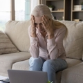 stressed older woman on couch