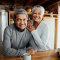 smiling older couple in kitchen