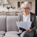 senior woman reviewing paperwork