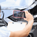 Car insurance adjuster taking photo of accident