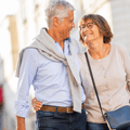Older couple walking on street