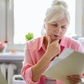 senior woman reviewing papers