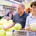 Mature couple doing groceries