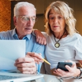 Older couple looking at their finances