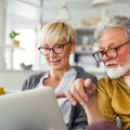 Retired couple on laptop