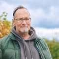 Portrait of a man in his 60s outdoors during autumn