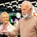 Elderly couple paying at the grocery store