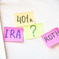 IRA, 401(k), Roth written on colorful sticky notes