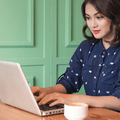 Woman on computer at coffee shop