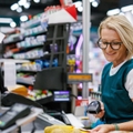 Senior woman working as a cashier 
