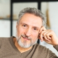 Man in his mid 60s looking at camera