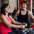 Two senior women working out at the gym