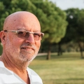 portrait of 65-year-old man in a park 