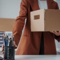 Woman cleaning her desk, leaving her job