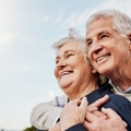 Happy elderly couple hugging