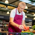 Senior working at grocery store