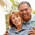 Smiling older couple in garden
