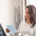 Mature woman reviewing a letter