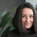 Woman in her 40s smiling at camera