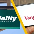 Fidelity Investments sign and Vanguard on mobile phone